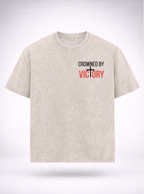 Beige t-shirt with motivational text on a white background